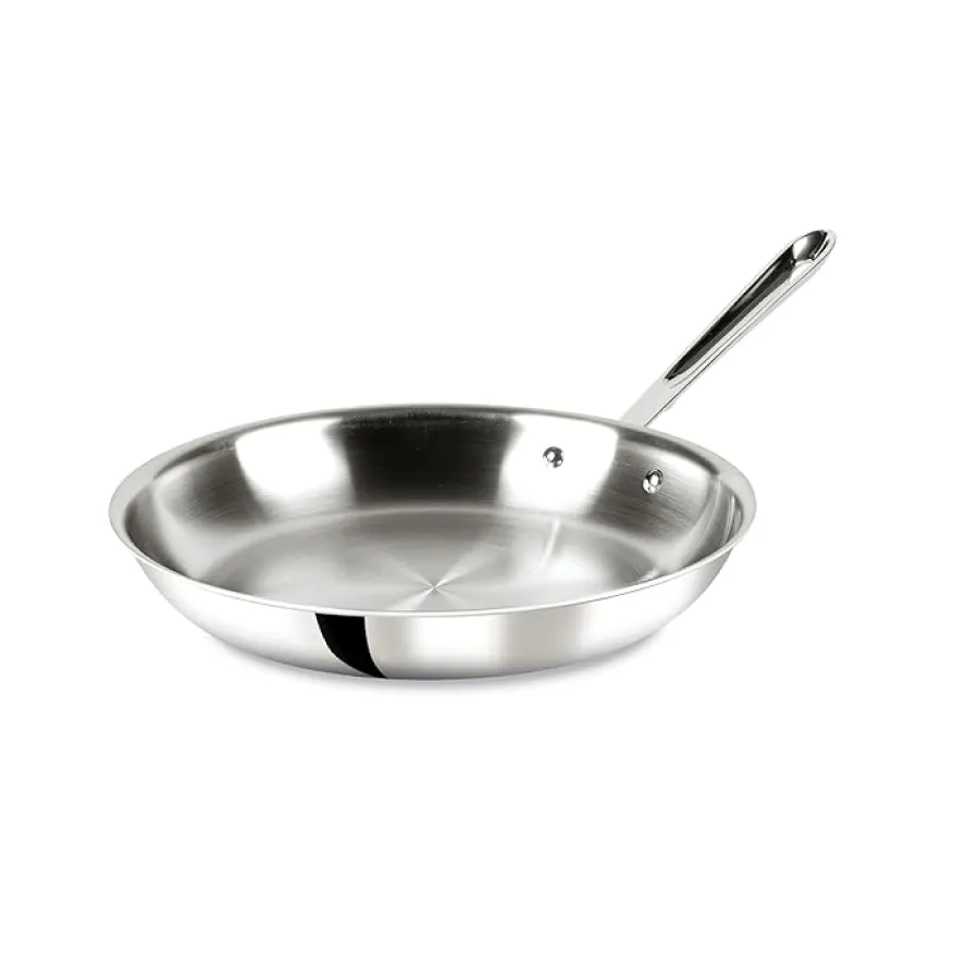 Polished stainless steel frying pan with a long handle on white background.