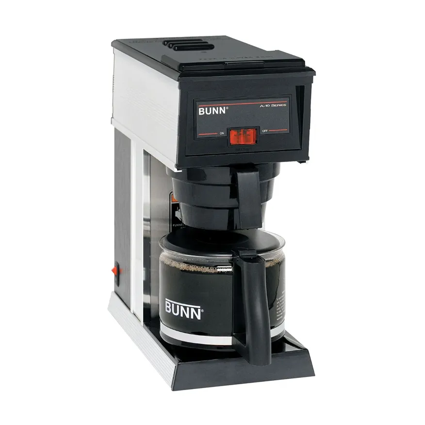 Bunn brand drip coffee maker with glass carafe filled with coffee.