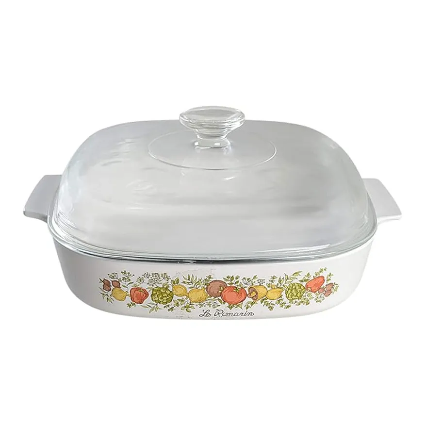 White rectangular CorningWare casserole dish with vegetable pattern and clear glass lid.