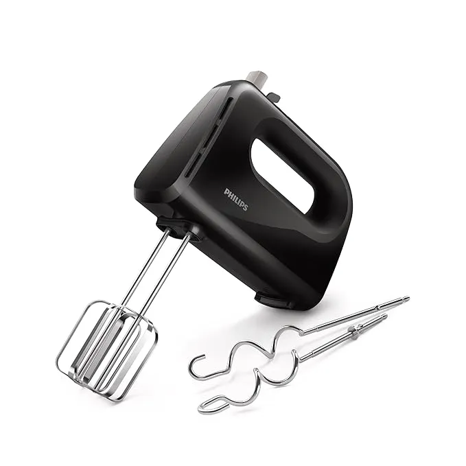 Black Philips electric hand mixer with one beater attached and two dough hooks beside it on a white background.