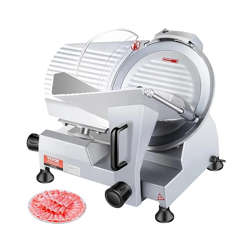 Electric meat slicer with transparent food guard and a plate of thinly sliced meat rolls.